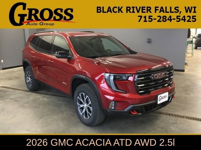 2026 GMC Acadia AT4 in Volcanic Red Tintcoat — front three-quarter view